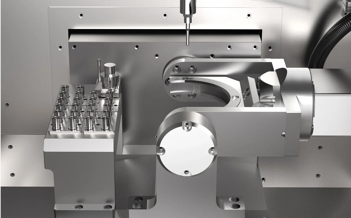 Рабочая зона станка X-Mill 630: шпиндель, магазин фрез и поворотный узел
